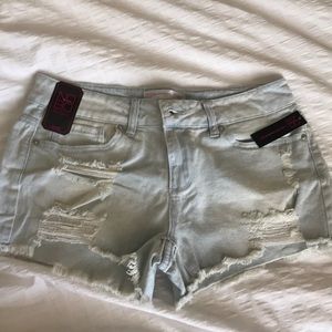 Light wash distressed shorts